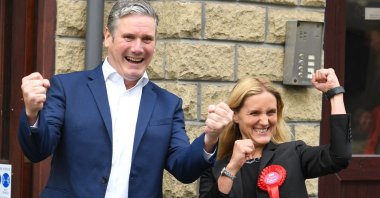 Britain's main opposition Labour Party leader Keir Starmer (L) and Labour Party's Kim Leadbeater celebrate victory outside the campaign center following the Batley and Spen by-election in Cleckheaton, West Yorkshire on July 2, 2021. (AFP Photo)