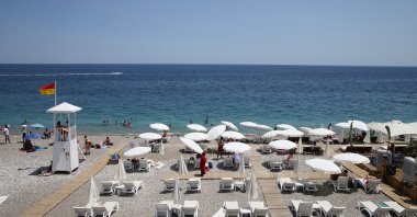 People enjoy the hot weather at Konyaaltı beach, Antalya, southern Turkey, June 28, 2021. (AA Photo)