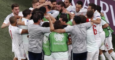 Spain's team celebrates after winning the Euro 2020 football championship quarterfinal match between Switzerland and Spain at Saint Petersburg Stadium in Saint Petersburg, Russia, July 2, 2021. (AP Photo)