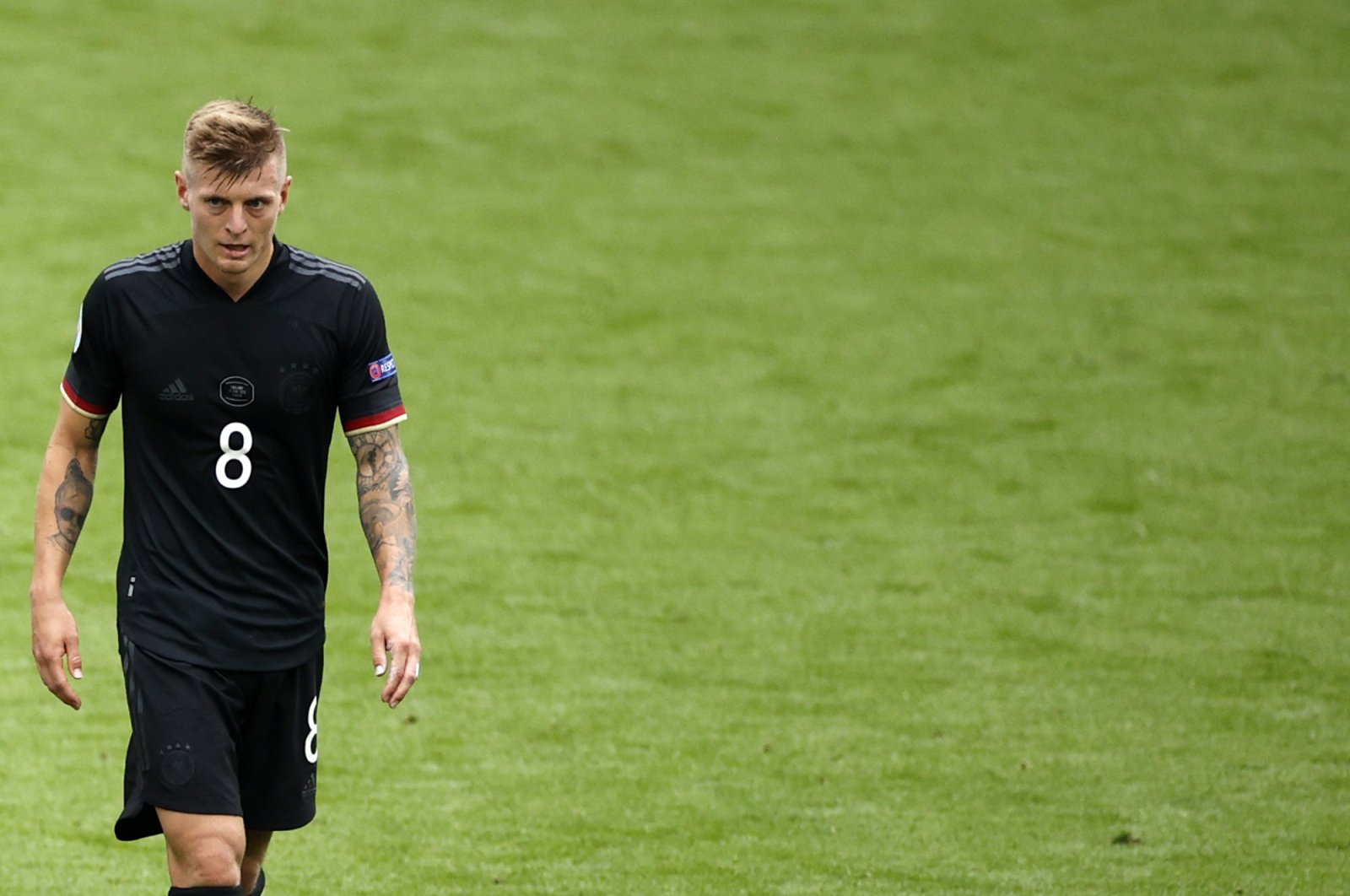 Germany's Toni Kroos leaves the pitch at halftime during the Euro 2020 football match round of 16 between England and Germany at Wembley stadium in London, U.K., June 29, 2021. (Pool via AP)