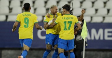 Brazil's Lucas Paqueta celebrates with teammate Neymar after scoring the only goal during a Copa America quarterfinal football match against Chile at the Nilton Santos stadium in Rio de Janeiro, Brazil, July 2, 2021. (AP Photo)