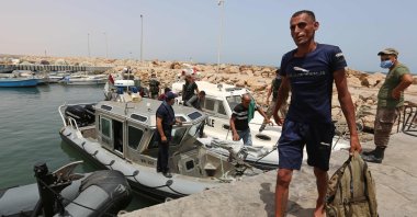 Migrants rescued by Tunisia's national guard during an attempted crossing of the Mediterranean by boat, arrive at the port of el-Ketef in Ben Guerdane in southern Tunisia near the border with Libya, June 27, 2021. (AFP Photo)