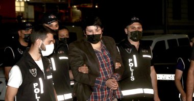Mehmet Aydın (C) is escorted by police to Istanbul Police Headquarters, Istanbul, Turkey, July 4, 2021. (AA Photo)