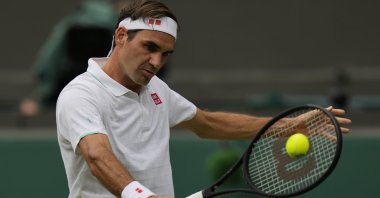 Switzerland's Roger Federer plays a return during the Wimbledon men's singles third-round match against Britain's Cameron Norrie London, England, July 3, 2021. (AP Photo)