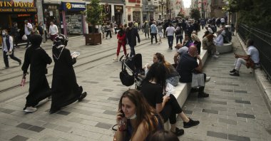 People walk along Istiklal Avenue, Istanbul's biggest shopping street, Turkey, May 28, 2021. (AP Photo)