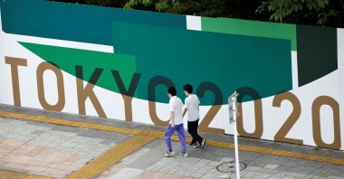 People walk past 2020 Tokyo Olympic Games advertisement banners in Tokyo, Japan, June 27, 2021. (Reuters Photo)
