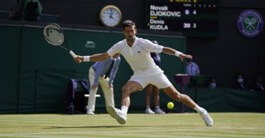 Serbia's Novak Djokovic plays a return to Denis Kudla of the U.S. during the Wimbledon men's singles third round match in London, England, July 2, 2021. (AP Photo)