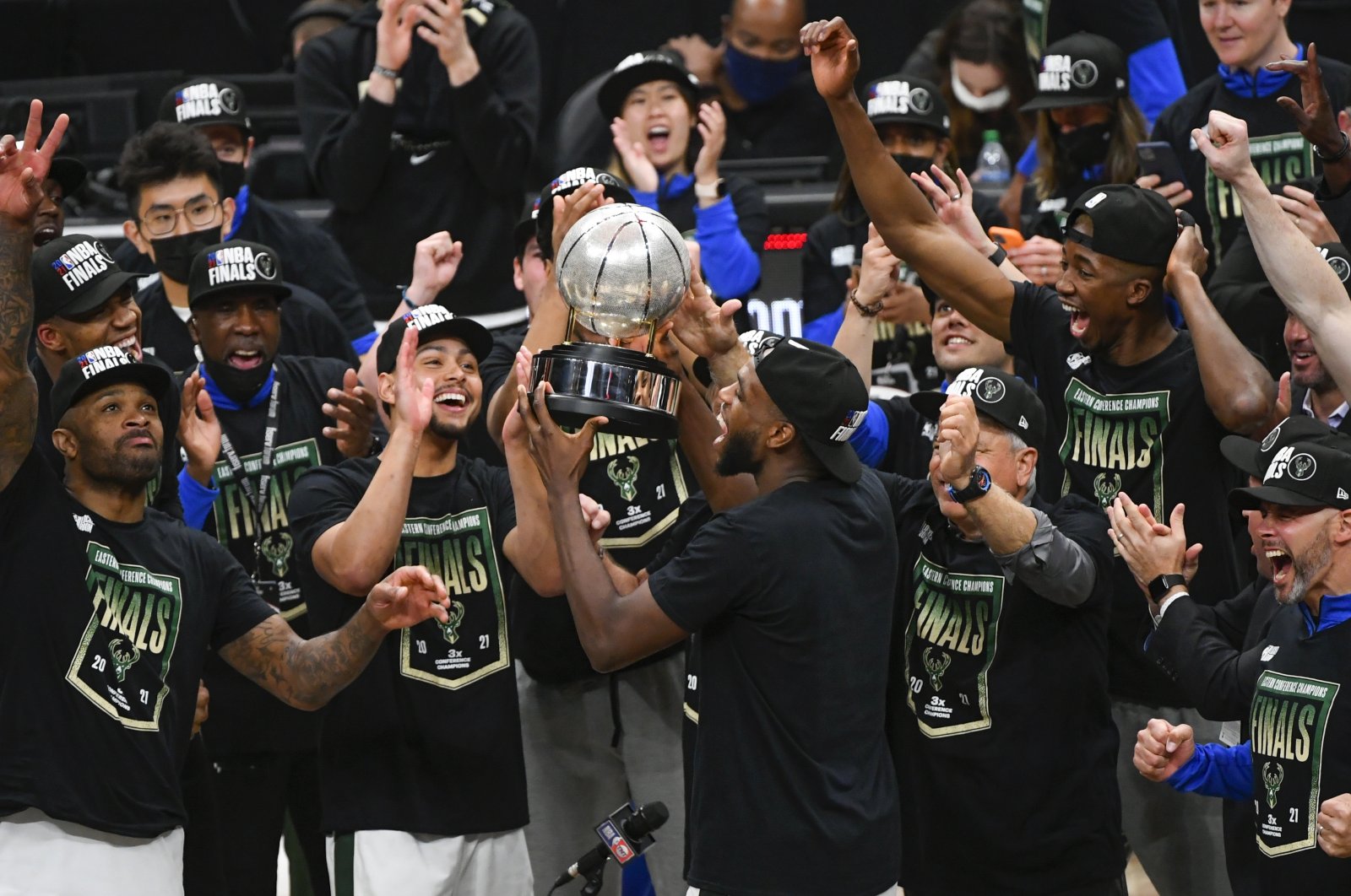Milwaukee Bucks forward Khris Middleton (C) and teammates celebrate winning the NBA Eastern Conference title after game six of the playoff series against the Atlanta Hawks at State Farm Arena in Atlanta, Georgia, U.S., July 3, 2021. (EPA Photo)