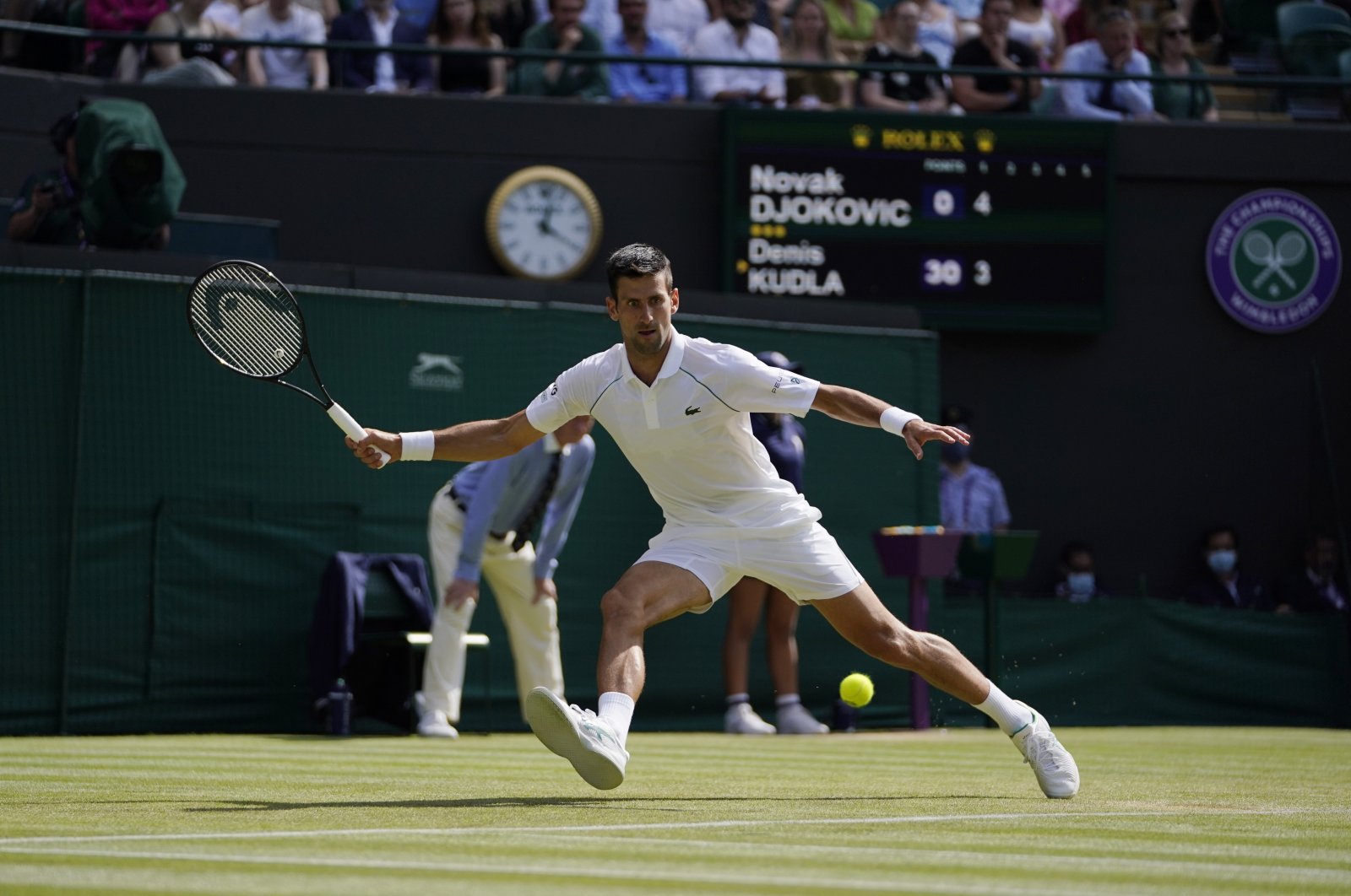 Serbia's Novak Djokovic plays a return to Denis Kudla of the U.S. during the Wimbledon men's singles third round match in London, England, July 2, 2021. (AP Photo)