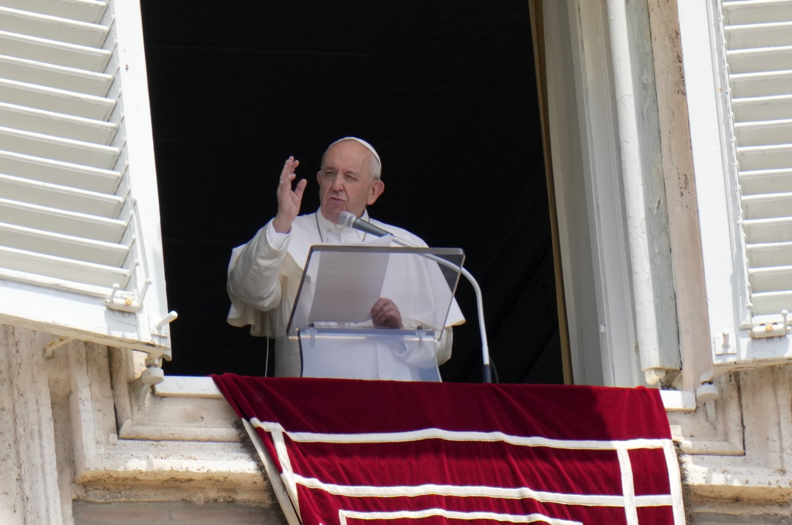 Pope Francis recites the Angelus noon prayer from the window of his studio overlooking St.Peter's Square, at the Vatican, Sunday, July 4, 2021. (AP Photo)