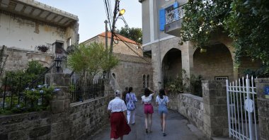 Tourists visit Batroun village, north of Beirut, Lebanon, Friday, July 2, 2021. (AP Photo)