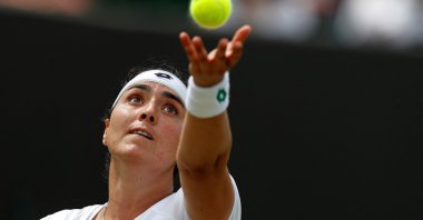 Tunisia's Ons Jabeur serves against Poland's Iga Swiatek during a fourth-round Wimbledon match in London, England, July 5, 2021. (AFP Photo)