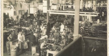 An old photo shows some workers during their shift in Sümerbank Beykoz Leather and Shoe Factory from "Kundura Memory" exhibition. 