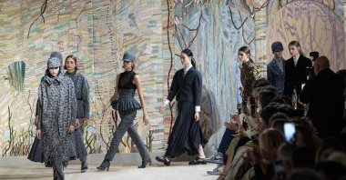 Models wear creations for Dior's Haute Couture Fall-Winter 2021-2022 fashion collection presented in Paris, France, July 5, 2021. (AP Photo)