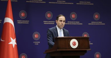 Foreign Ministry spokesperson Tanju Bilgiç listens during a press conference in Ankara, Turkey, June 25, 2021. (AA File Photo)