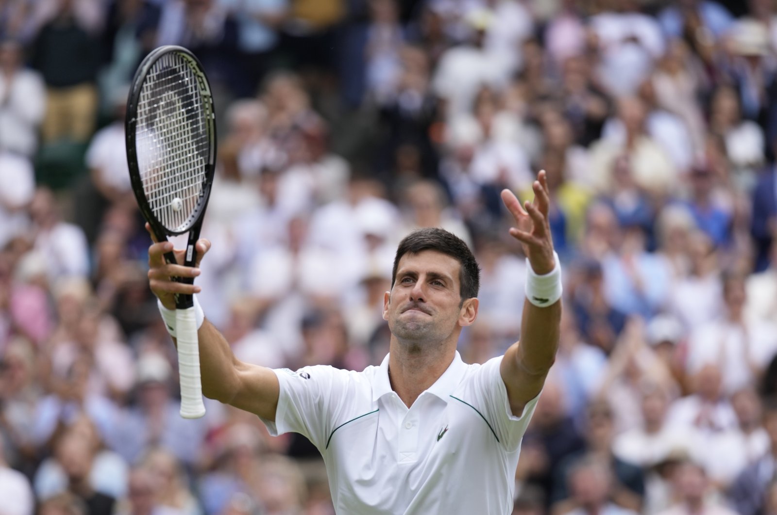 Serbia's Novak Djokovic celebrates after defeating Chile's Cristian Garin in the Wimbledon men's singles fourth round match in London, England, July 5, 2021. (AP Photo)