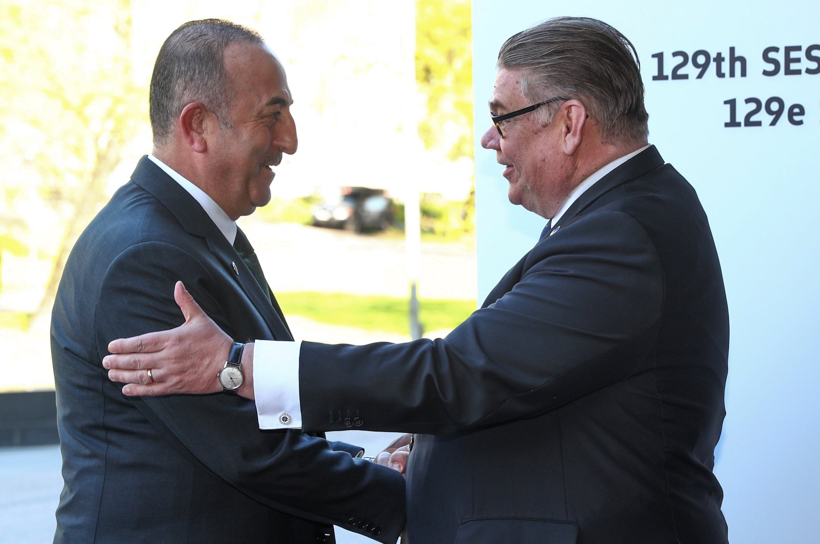 Turkish Foreign Minister Mevlüt Çavuşoğlu (L) is welcomed by Timo Soini, Finland's foreign minister and chairperson of the Committee of Ministers, ahead of the 129th session of the Committee of Ministers of the Council of Europe, Helsinki, Finland, May 17, 2019. (Getty Images)