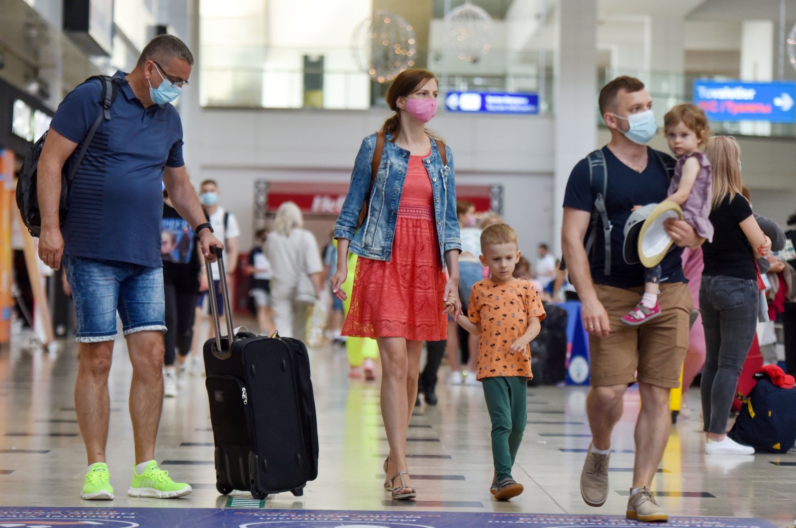 Russian tourists exit the airport as they arrive in Antalya, southern Turkey, June 29, 2021. (IHA Photo)