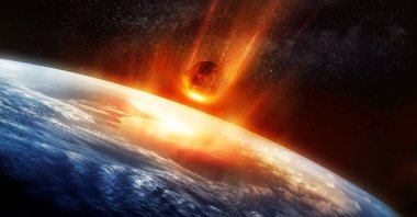 This 3D illustration shows a large meteor burning up as it hits Earth's atmosphere. (Getty Images)