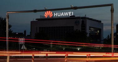 Surveillance cameras are seen in front of a Huawei logo in Belgrade, Serbia, Aug.11, 2020. (Reuters Photo)