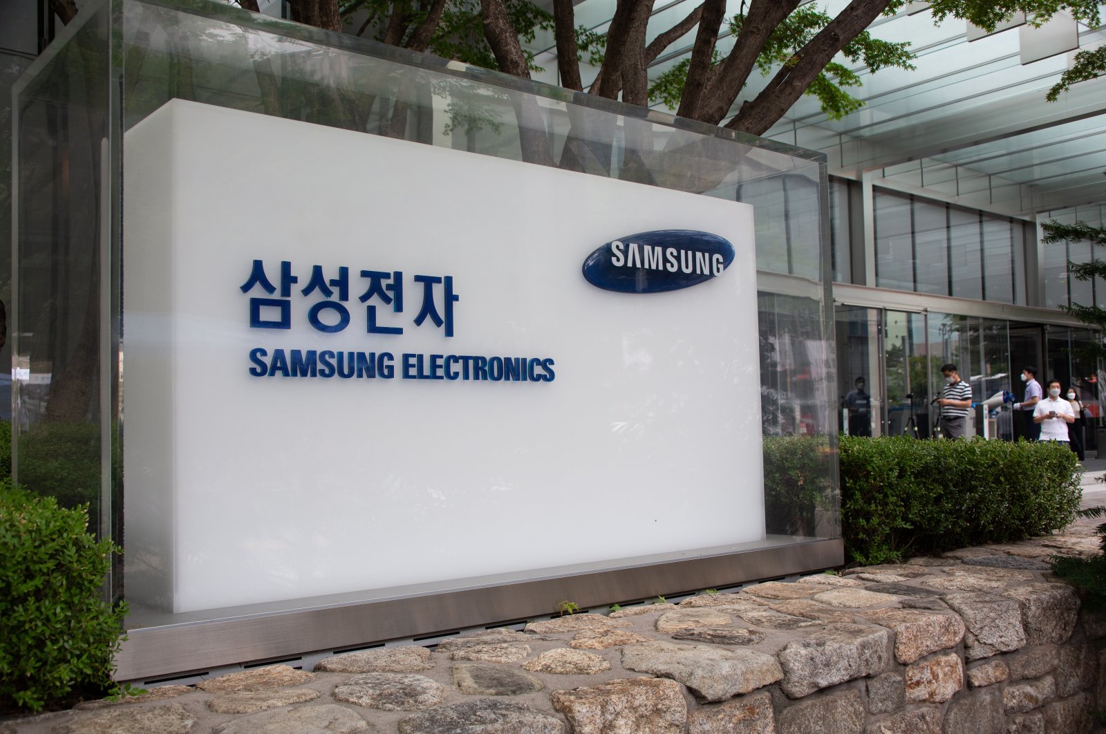 People walk outside the Samsung Electronics headquarters in Seoul, South Korea, July 7, 2021. (EPA Photo)