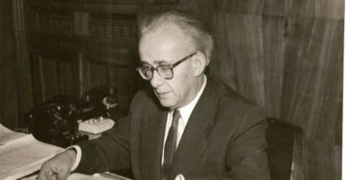 Tevfik Ileri photographed while working. (Wikipedia Photo) 