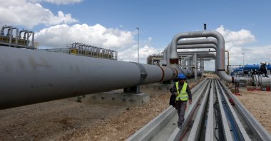 A local employe walks near a compressor station of the Trans Adriatic Pipeline (TAP) in Seman near Fier, Albania April 11, 2019. (Reuters Photo)