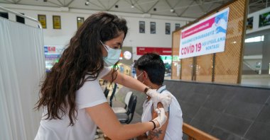 A man gets vaccinated at a vaccination spot inside a bus terminal, in Diyarbakır, southeastern Turkey, July 1, 2021. (İHA PHOTO) 