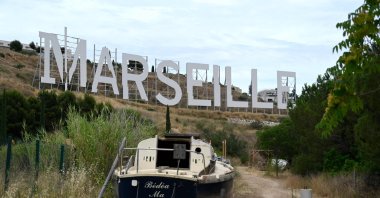 A giant sign similar to the one in Hollywood was installed by Netflix while the firm shoots the famous TV show "Marseille," in Marseille, southern France, July 7, 2021. (AFP Photo)