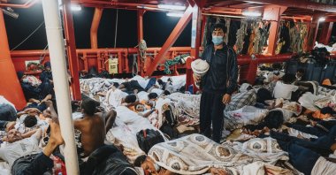 Rescued migrants sleep on the deck of the Ocean Viking rescue ship in the Mediterranean Sea, July 8, 2021. (AP Photo)