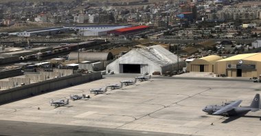 A side of Kabul Military Airport where AC 208 combat caravan aircraft are parked is seen from a commercial airplane, Afghanistan, July 7, 2021. (AP Photo)