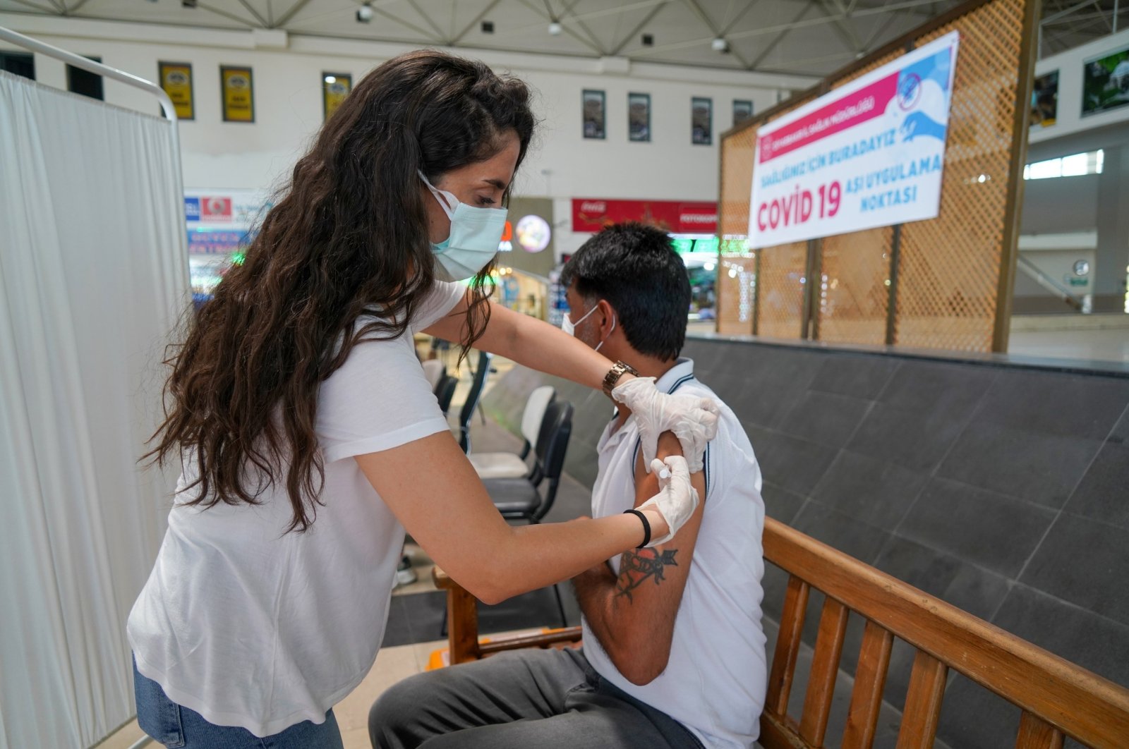 A man gets vaccinated at a vaccination spot inside a bus terminal, in Diyarbakır, southeastern Turkey, July 1, 2021. (İHA PHOTO) 