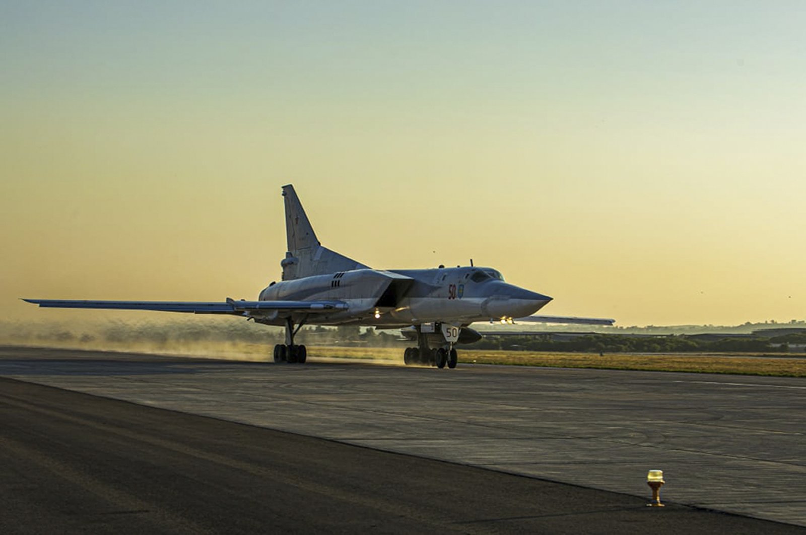 In this photo released by Russian Defense Ministry Press Service on Friday, June 25, 2021, a Tu-22M3 bomber of the Russian air force takes off from the Hemeimeem air base in Syria. (Russian Defense Ministry Press Service via AP, File Photo)