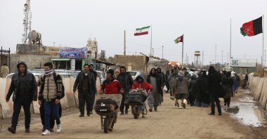 Afghans return to Afghanistan at the Islam Qala border with Iran, in the western Herat province, Afghanistan, Feb. 20, 2019. (AP Photo)