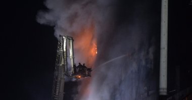 Firefighters try to extinguish a massive fire that broke out in a beverage and food factory in Narayanganj, central Bangladesh on July 9, 2021. (AFP Photo)