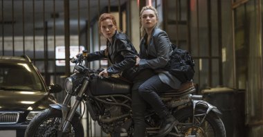 Scarlett Johansson (L) rides a motorcycle with Florence Pugh in a scene from the Marvel superhero film "Black Widow." (AP Photo)