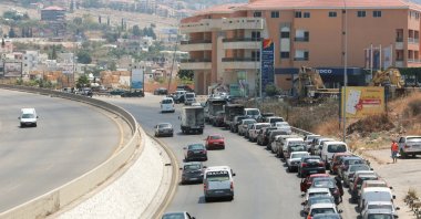 Cars line up to buy fuel at a gas station in Jiyeh, Lebanon, June 29, 2021. (Reuters Photo)