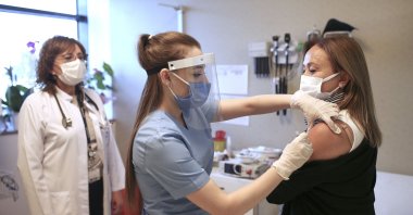 A nurse administers a CoronaVac vaccine to a volunteer for the Phase 3 trial, in Istanbul, Turkey, Dec. 21, 2020. (AP PHOTO) 