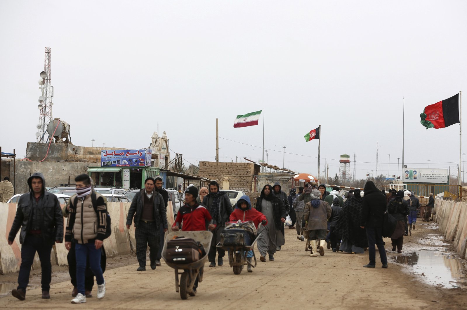 Afghans return to Afghanistan at the Islam Qala border with Iran, in the western Herat province, Afghanistan, Feb. 20, 2019. (AP Photo)