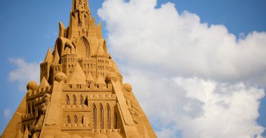 The world's tallest sand sculpture is under construction in Blokhus, Denmark, July 7, 2021. (AFP Photo)