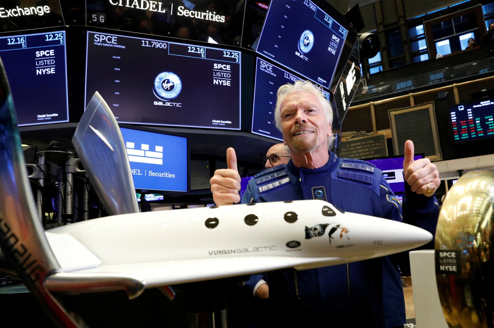 Sir Richard Branson poses on the floor of the New York Stock Exchange (NYSE) ahead of Virgin Galactic (SPCE) trading in New York, U.S., Oct. 28, 2019. (Reuters Photo)