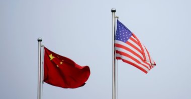 Chinese and U.S. flags flutter outside a company building in Shanghai, China, April 14, 2021. (Reuters Photo)