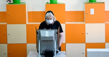A woman casts her vote at a polling station during the country's parliamentary election in Sofia, Bulgaria, July 11, 2021. (AFP Photo)