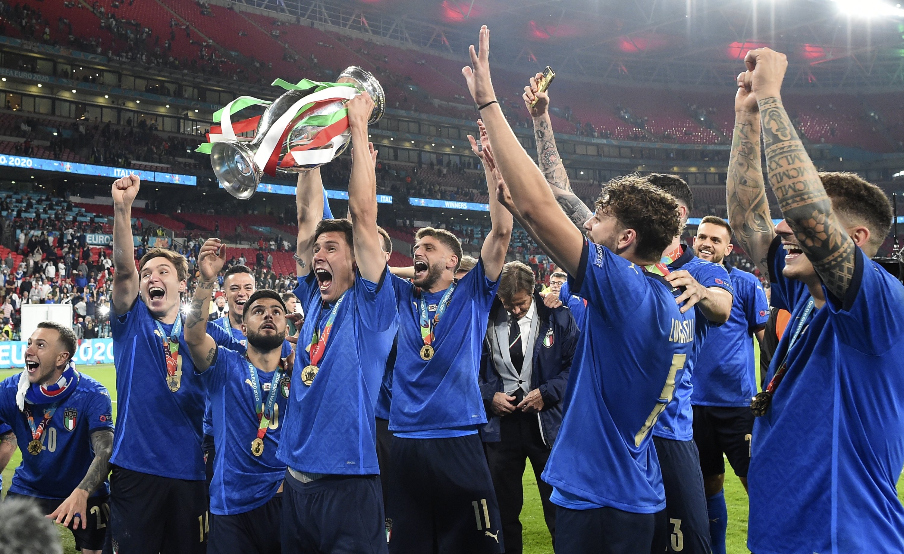 Italian players celebrate with the trophy after the Euro 2020 final match against England at Wembley stadium in London, England, July 11, 2021. (AP Photo)