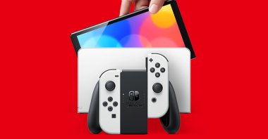 Nintendo Switch's OLED model is seen in this promotional poster (Image credit: Nintendo)