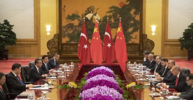 President Recep Tayyip Erdoğan (C-R) speaks during a meeting with Chinese President Xi Jinping (C-L) at the Great Hall of the People in Beijing, China, July 2, 2019. (Getty Images)