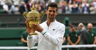 Serbia's Novak Djokovic with the trophy after winning the Wimbledon men's singles title, London, England, July 11, 2021.