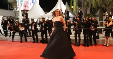 Norwegian actress Renate Reinsve dances as she arrives for the screening of the film “Verdens Verste Menneske” (The Worst Person In The World) at the 74th Cannes Film Festival in Cannes, France, July 8, 2021. (AFP Photo)