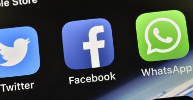 The icons of Facebook and WhatsApp are pictured on a phone in Gelsenkirchen, Germany, Nov. 15, 2018. (AP Photo)
