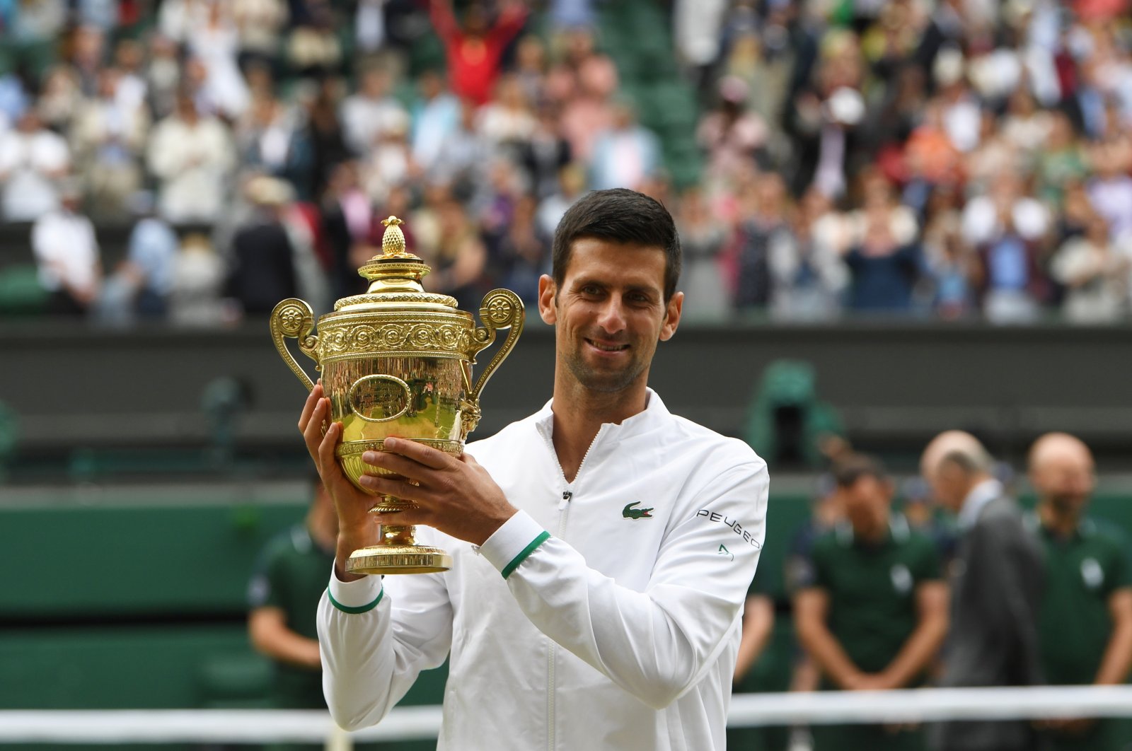 Serbia's Novak Djokovic with the trophy after winning the Wimbledon men's singles title, London, England, July 11, 2021.